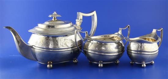 A George III silver three piece tea set, gross 32.5 oz.